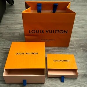 Louis Vuitton packages (2 boxes and one shopping bag)